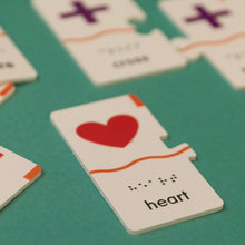 Load image into Gallery viewer, Memory Puzzle: Shapes puzzle piece with a heart design. Tactile printing with Braille and English. 
