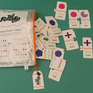 Shapes Memory Puzzle pieces with English, Braille, and tactile printing. 